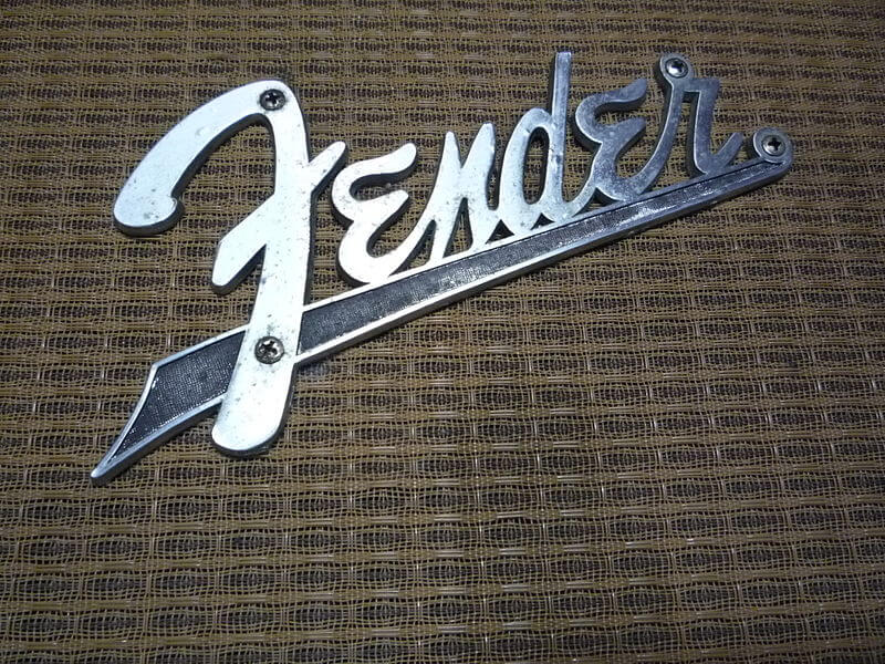 Closeup on a Fender logo on a vintage amp