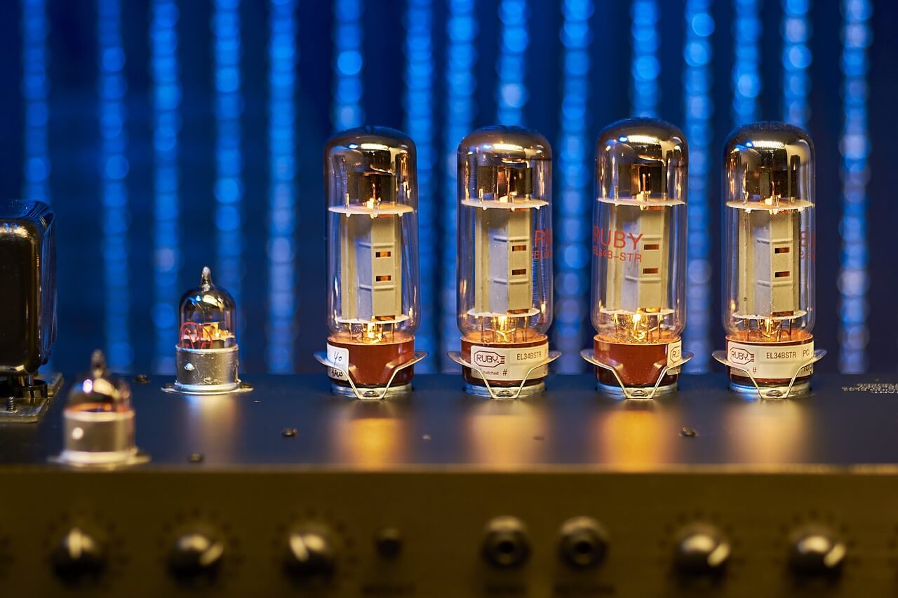 A set of vacuum tubes against an electric blue background